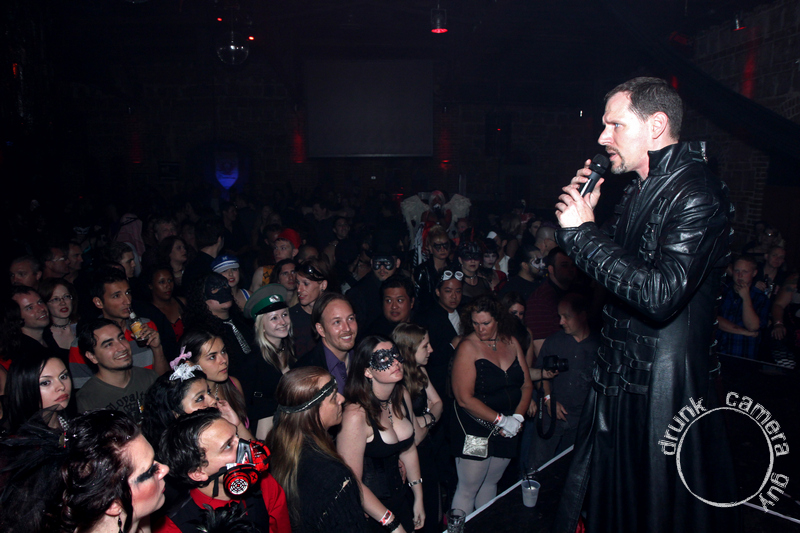 Evan Christopher addressing the crowd from the main stage at Taboo Masquerade + Fetish Ball #6